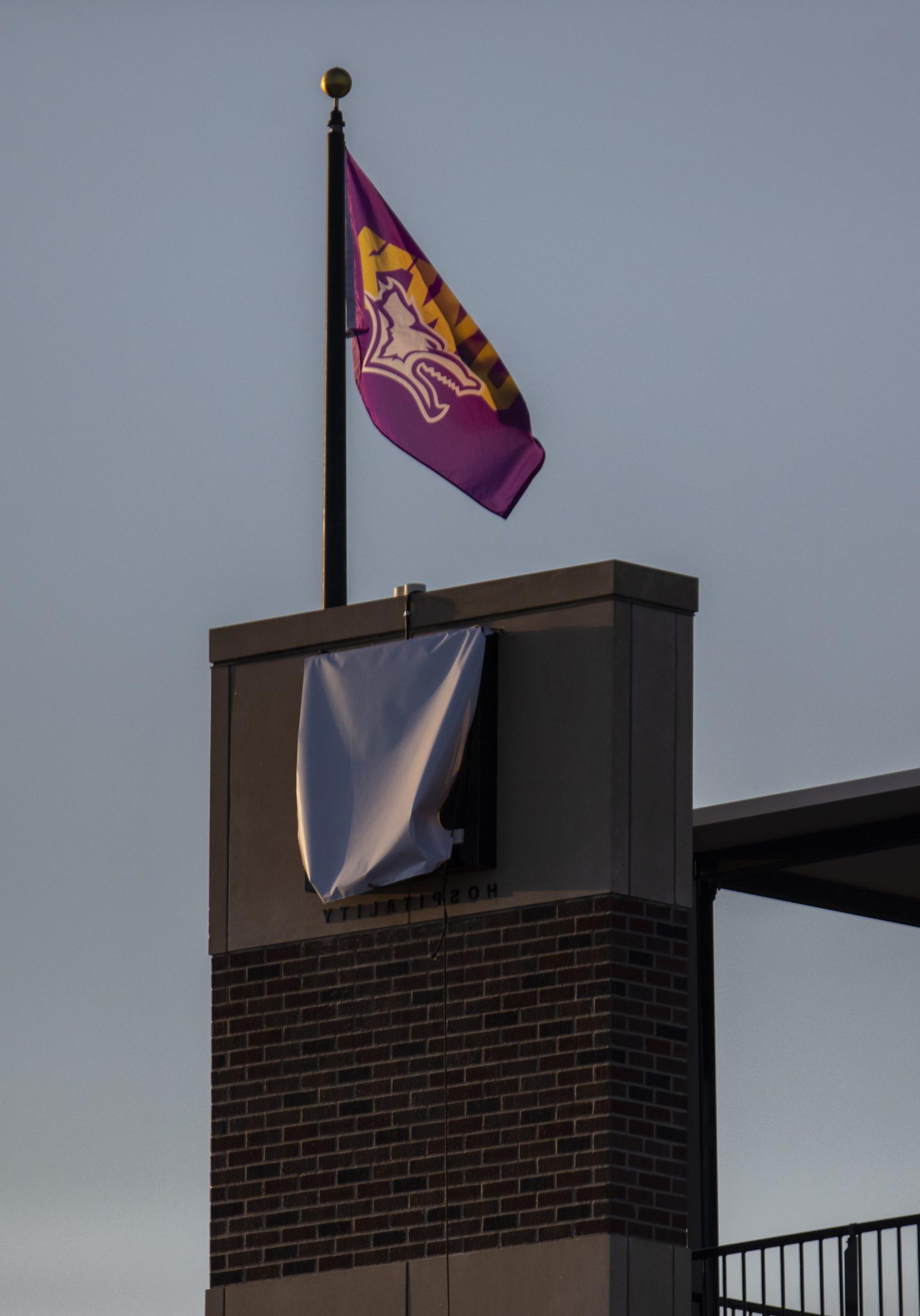 Sign on outside of stadium - covered